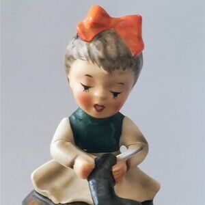 SEAMSTRESS GIRL WITH ORANGE BOW FIGURINE
